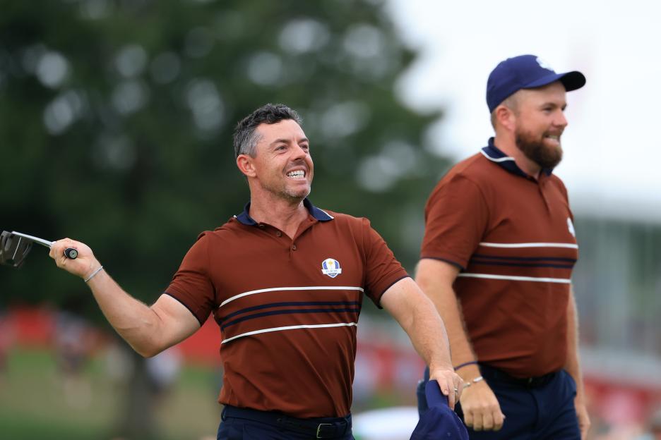Rory McIlroy and Shane Lowry of Europe celebrate winning their Ryder Cup match.