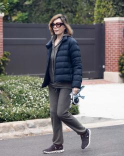 Anne Archer walking down a street.