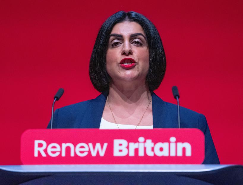 Shabana Mahmood delivering a speech at a Labour party conference with the slogan "Renew Britain" visible.