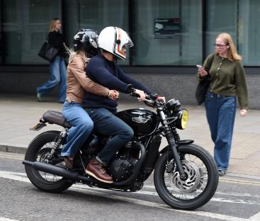Helen Skelton and Gethin Jones on a motorcycle.