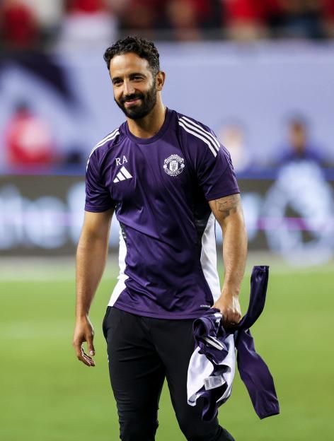 Ruben Amorim, head coach of Manchester United, on a soccer field.