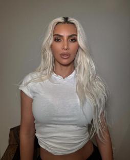Kim Kardashian in a white shirt.