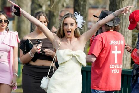Grand National revellers impress in eye-catching dresses at Aintree’s Ladies Day as the sun shines and bubbly flow
