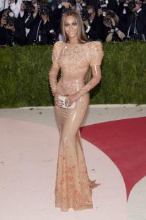 Beyoncé Knowles at the Met Gala in a sheer, floral gown.