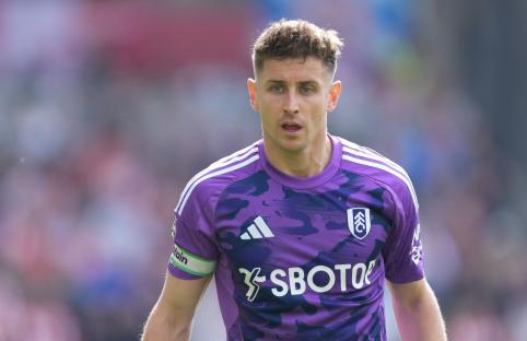 Fulham's Tom Cairney in purple jersey.