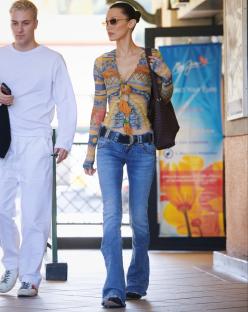 BGUK_3162710 - Studio City, CA - *EXCLUSIVE* - Bella Hadid was spotted running errands with a male pal in LA on Monday. The model, known for her style influence, was spotted visiting an eyewear shop in Studio City. She wore a vintage Jean Paul Gaultier currency top, with low-rise jeans and cowboy boots. She carried chocolate colored woven shoulder bag as she made her way to her way to the shop.....Pictured: Bella Hadid....BACKGRID UK 24 FEBRUARY 2025 ....UK: +44 208 344 2007 / uksales@backgrid.com....USA: +1 310 798 9111 / usasales@backgrid.com....*Pictures Containing Children Please Pixelate Face Prior To Publication*
