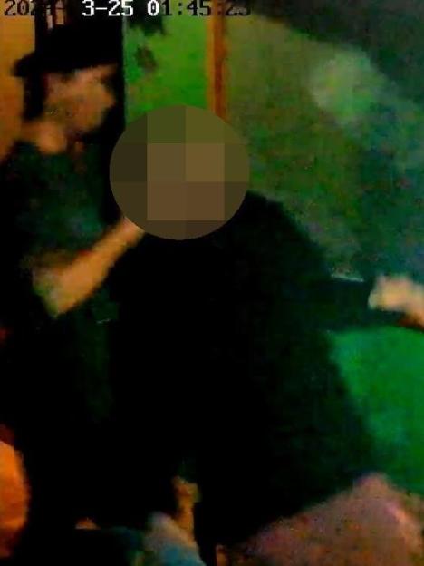 CCTV footage of a person assaulting another.