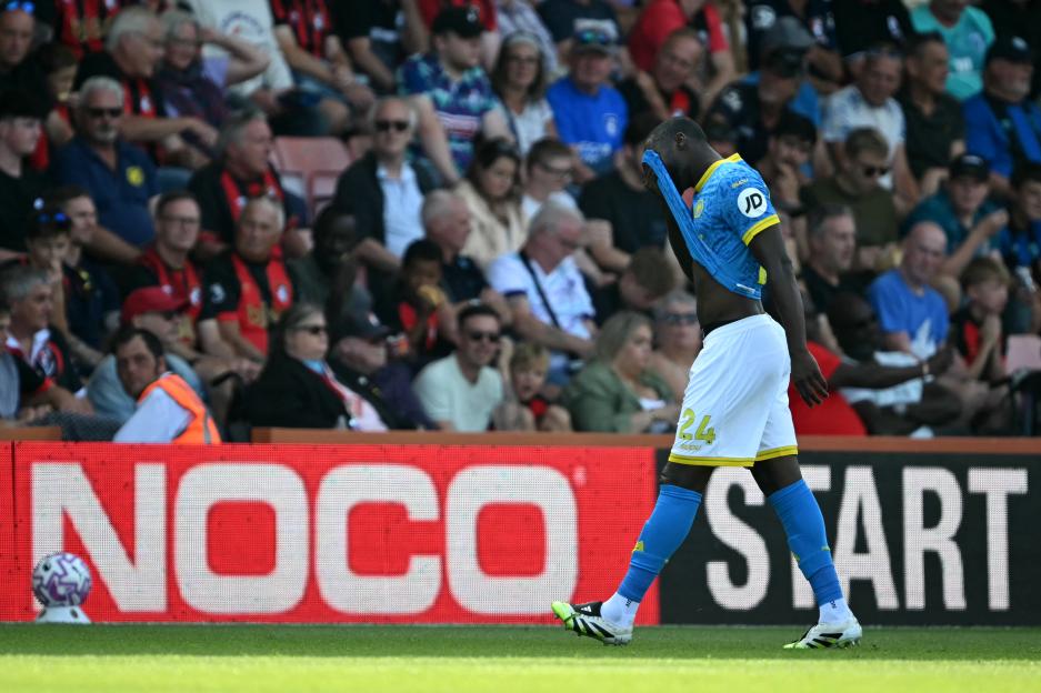 Soccer player #24 Toti Gomes leaves the field after receiving a red card.