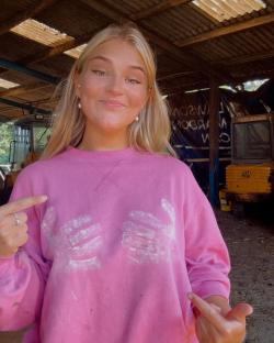 Harriet Cowan, Clarkson's new farmhand, pointing to paint on her pink sweatshirt.