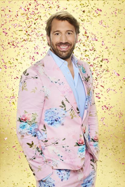 Chris Robshaw, smiling in a pink floral suit, on Strictly Come Dancing.