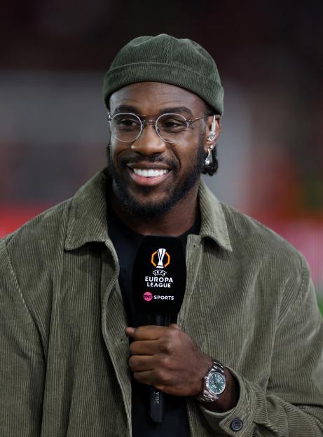 Michail Antonio holding a microphone with the UEFA Europa League logo.