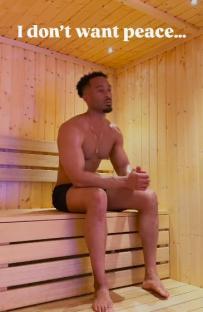 Man sitting in a sauna, saying