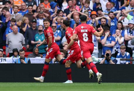 Southend United soccer players celebrating a goal.