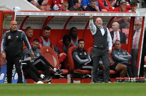 Swindon manager Ian Holloway on the sidelines during a soccer match.