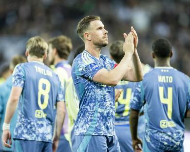 Ajax player Jordan Henderson applauding after a match.