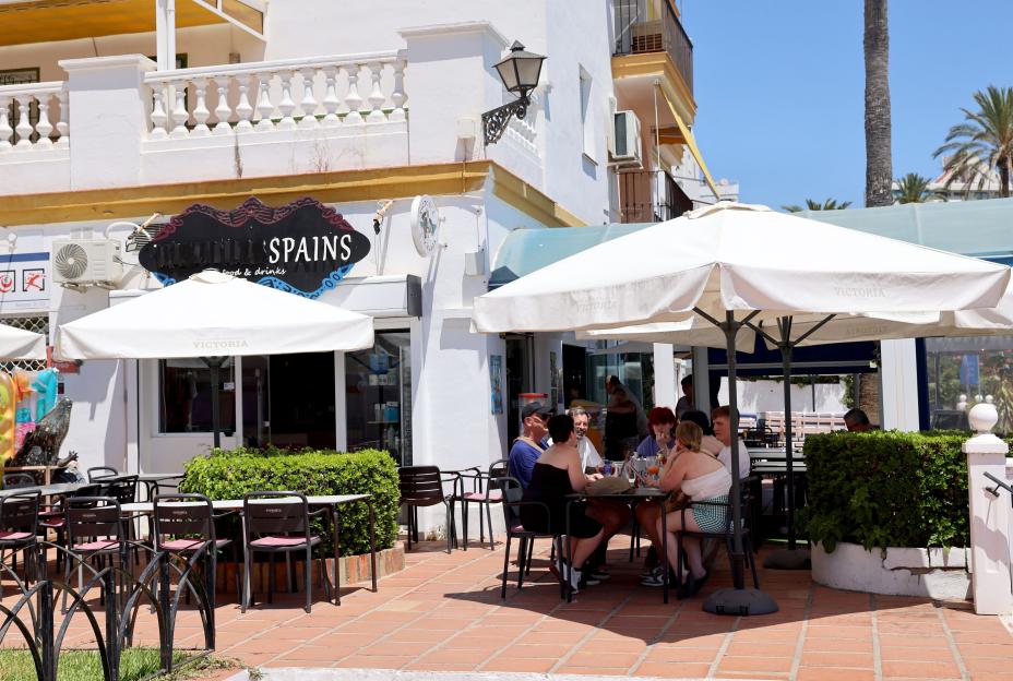 Patrons seated at tables outside the WeatherSpains Bar on the Costa Dels.
