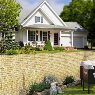 Reed fence installed in a backyard.