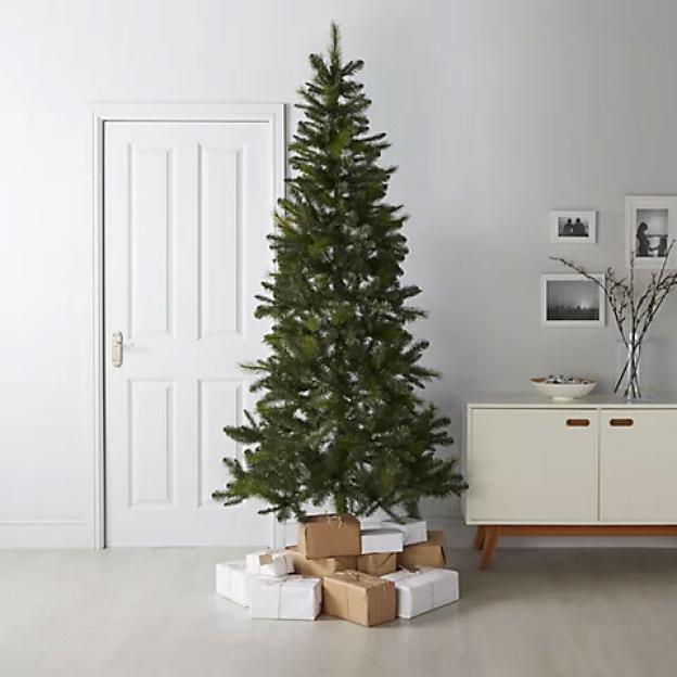 7.6ft artificial Christmas tree surrounded by presents.