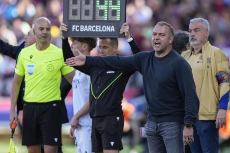 Hansi Flick, FC Barcelona's head coach, gestures during a soccer match.
