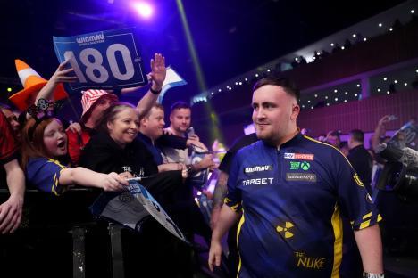 Luke Littler at a darts match.