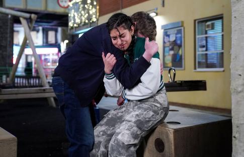 Avani Nandra-Hart crying and being comforted by Barney Mitchell in an EastEnders scene.