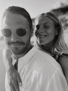 Black and white photo of a couple embracing.