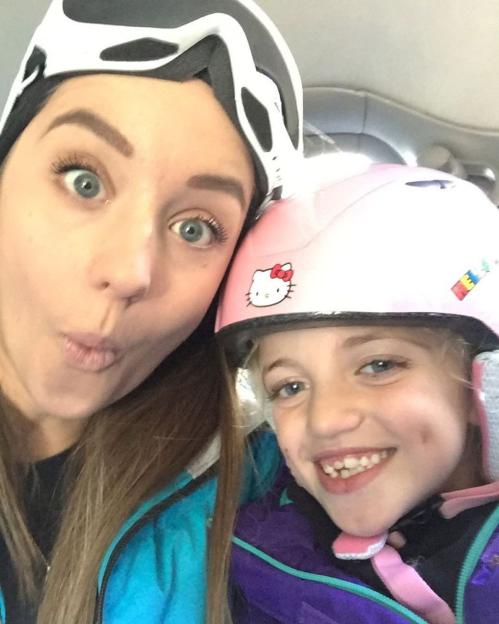Princess Andre and a young girl making funny faces for a selfie.