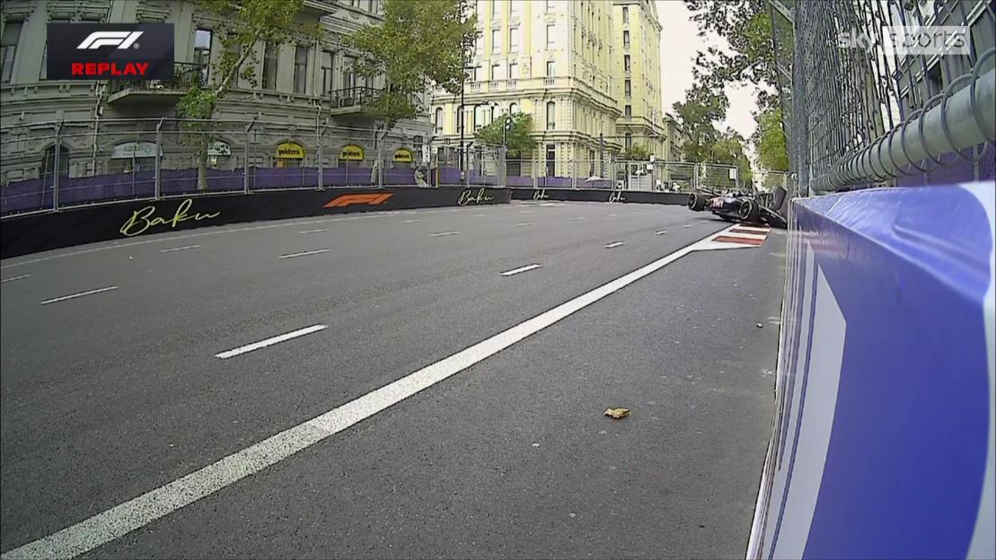A crashed Formula 1 car is visible on the street circuit in Baku.