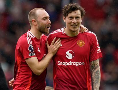 Christian Eriksen and Victor Lindelof of Manchester United joking together.
