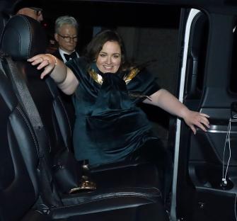 Jessica Gunning exiting a vehicle.