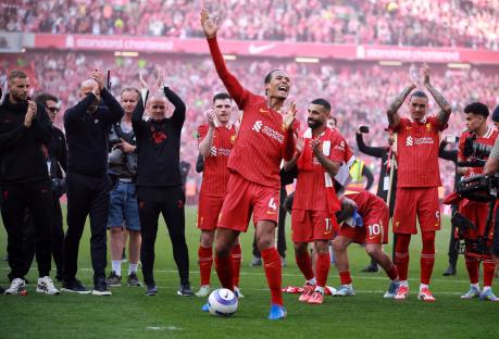 Liverpool's Virgil van Dijk and teammates celebrating a win.