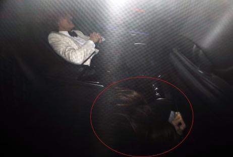 Tom Cruise and his girlfriend leaving a party.