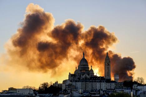 Huge fire in Paris sends black smoke across city of light as fire crews scramble to extinguish blaze
