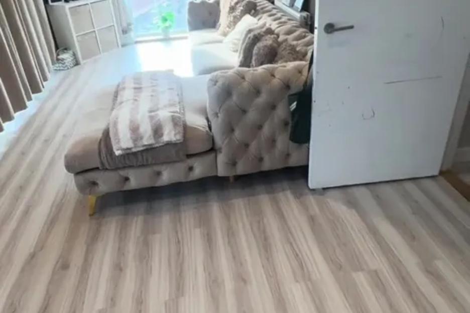 I swapped my dirty old carpet for stick-on laminate – it looks so good that no one believes it’s from TikTok Shop