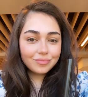 Woman after 60lb weight loss, showing her