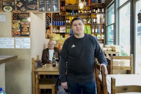 Restaurant owner standing in his shop, which is closing down.