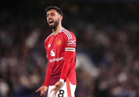 Bruno Fernandes of Manchester United looks frustrated during a soccer match.