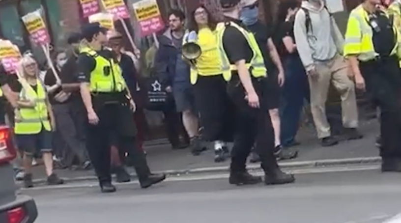 Police officers monitoring a protest.