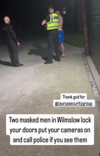 Police officers apprehending a suspect at night.