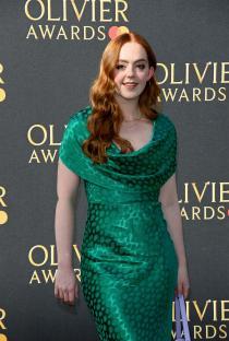 Lauren Byrne at the Olivier Awards in a green spotted satin dress.