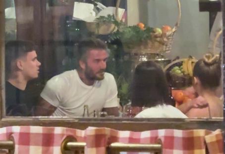 David Beckham, Romeo Beckham, and Harper Beckham dining at a restaurant in Paris.