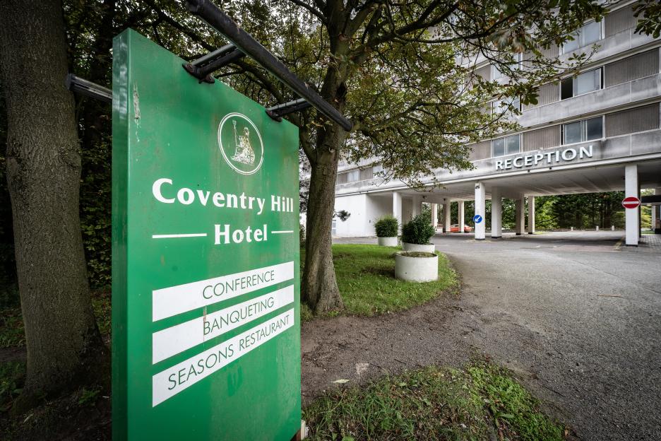 Coventry Hill Hotel sign and building.
