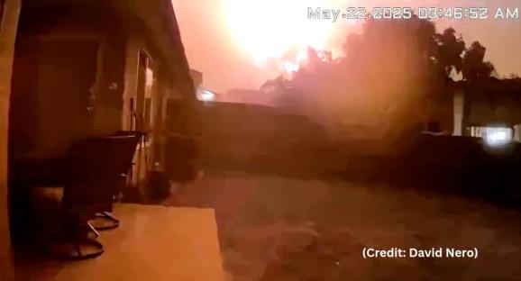 Screenshot of a large fire at night.