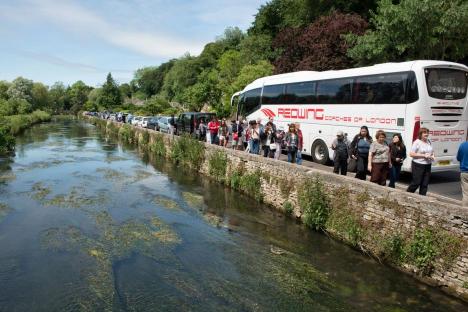 We live in England’s ‘most beautiful village’ but we’re overrun with annoying tourists – now we want to BAN coaches