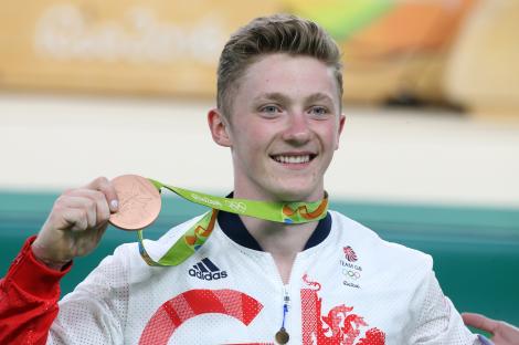 Nile Wilson of Great Britain celebrates winning a bronze medal in men's horizontal bar at the Rio 2016 Olympic Games.