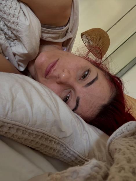 Woman lying in bed.