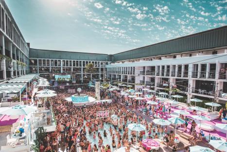 Aerial view of a crowded pool party at Ibiza Rocks.