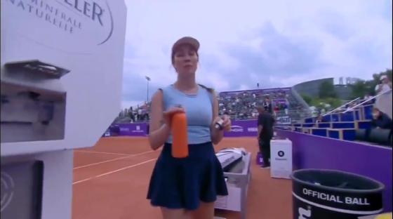 Danielle Collins asking a cameraman for space during a tennis match.