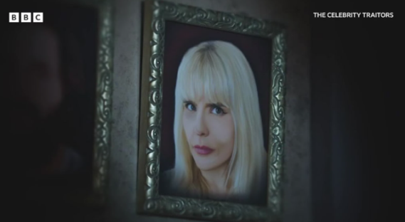 Framed portrait of a blonde woman from *The Celebrity Traitors*.