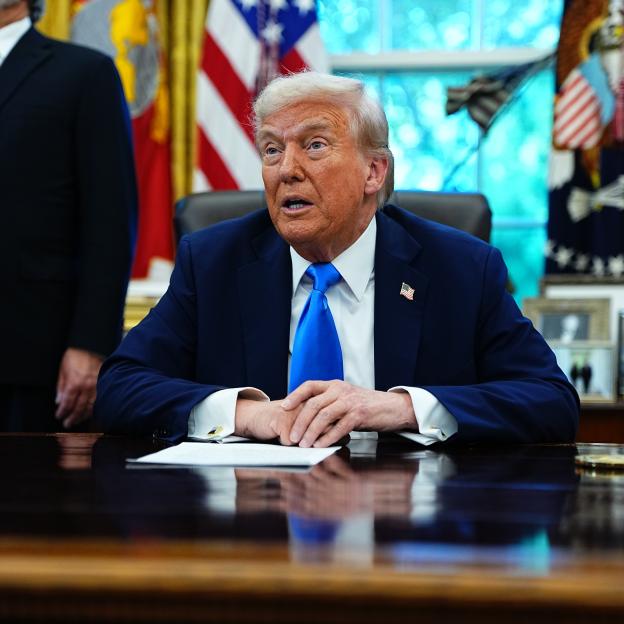 United States President Donald J Trump speaks to the media in the Oval Office.